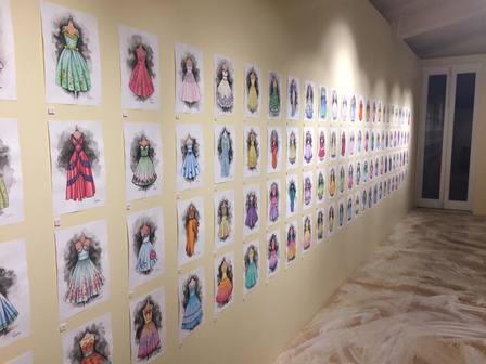 100 dresses exhibition wall of artworks