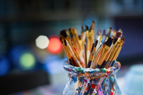 artists brushes in a jar