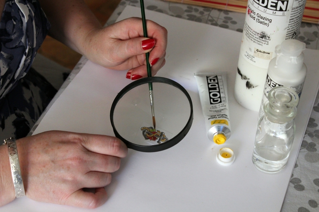 hand painting a jewellery necklace insert