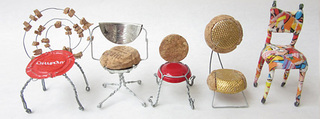 Lineup of miniature  champagne cork chairs