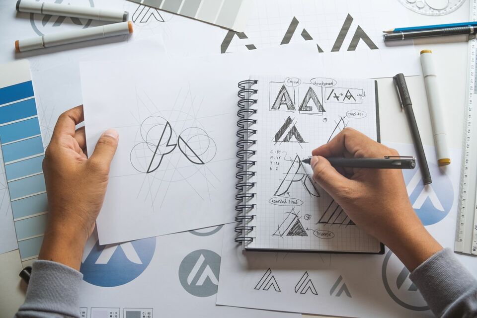 graphic artist drawing logos