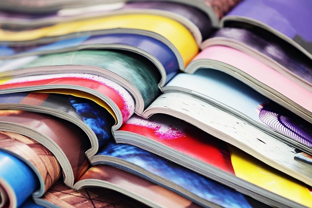 pile of magazines open on colourful pages