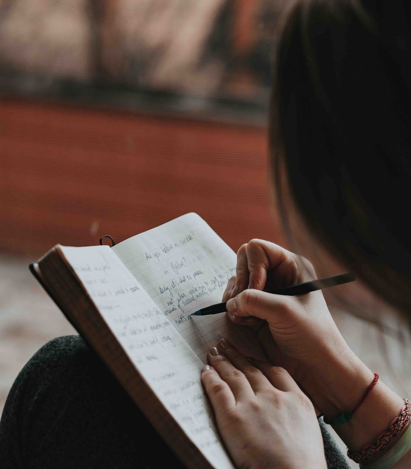 woman writing in a diary