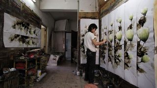 artist making mass produced art in China