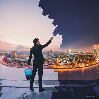 Man in suit painting himself in or out