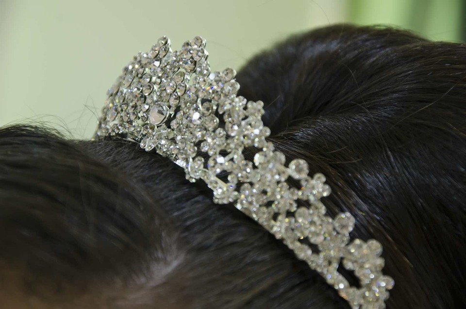 a tiara on dark hair