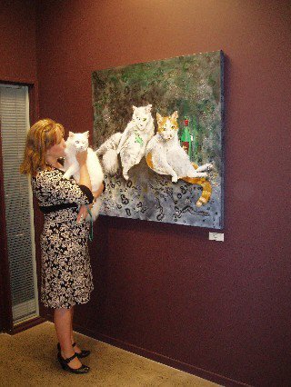 Lady and cat at Collette Fergus art exhibition
